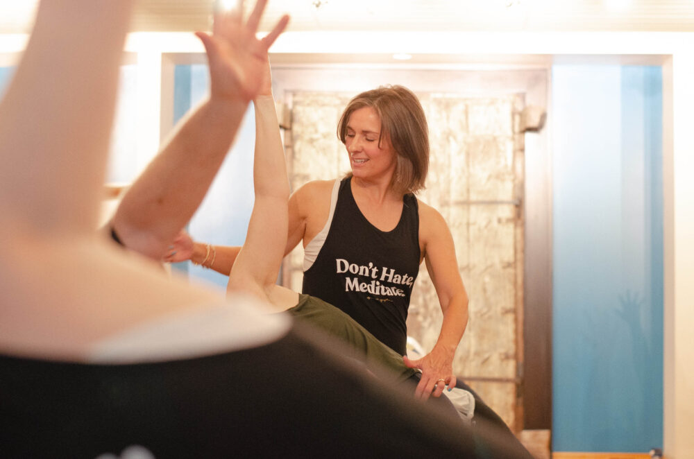 Donna Farchione leading a yoga session at Glow Yoga and Juice in Fayetteville, New York